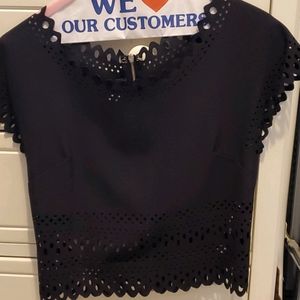 Bebe black crop top with decorative cut out edge